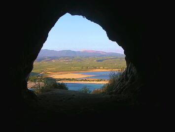 NestorCave4 View from the Cave of Nestor to Voidokoilia. - http://www.ancient-greek-sites.info/PEL/MES/Voidokoilia/index.html