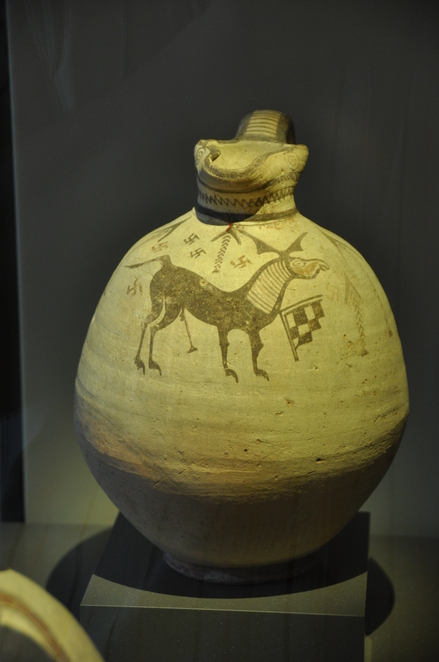 Atheniou, Archaic jar with swastica and deer