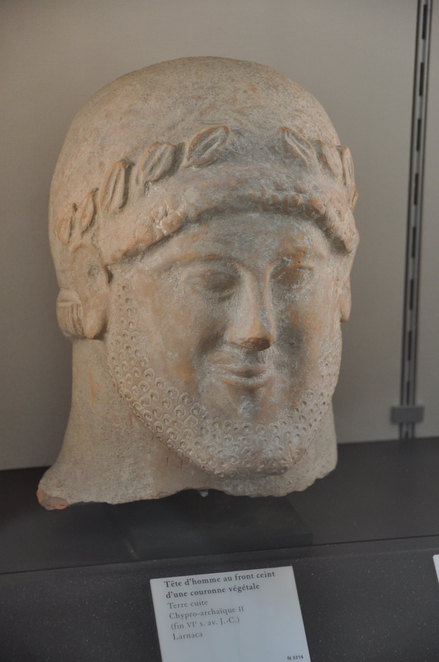 Cyprus, Head of a bearded man en face with a vegetal wreathe