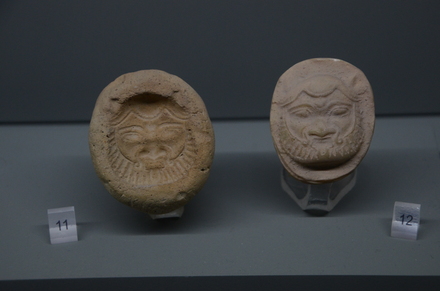 Clay mould head of the god Bes