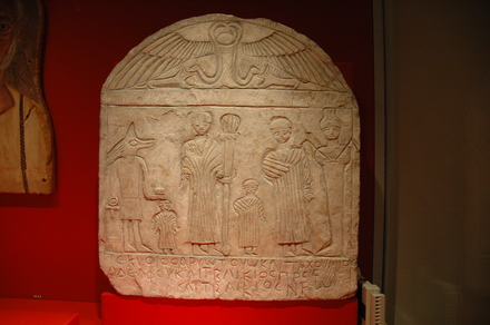 Abydos, Funerary stele with four figures, flanked by Osiris and Anubis