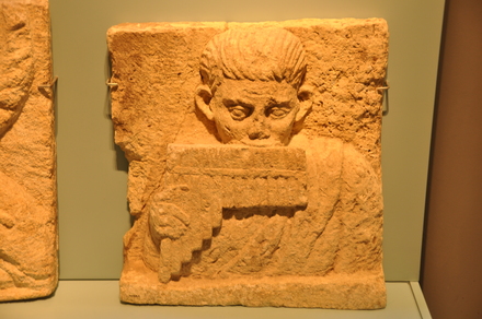 Oxyrhynchus, Relief of a flute player