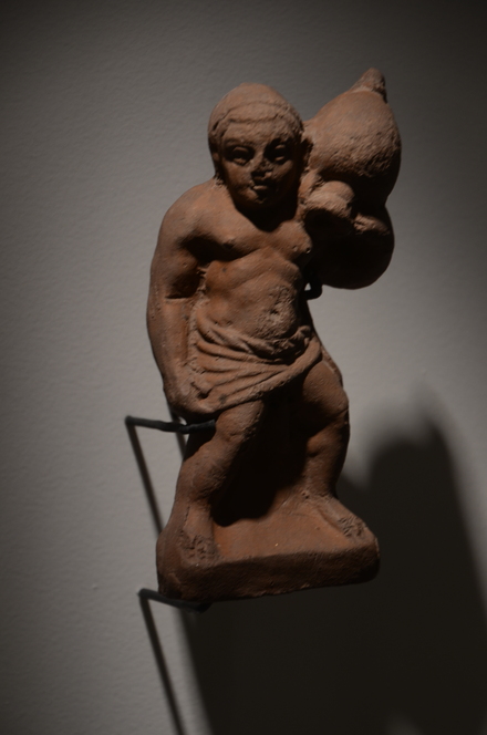 Statuette of a man with am amphora (fertility symbol)