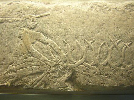Relief of a farmer with cows