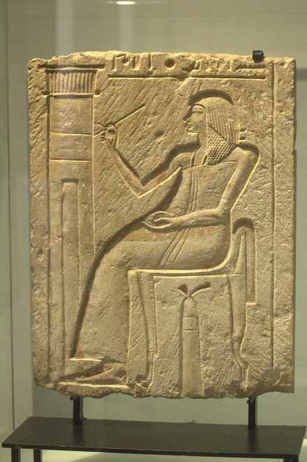 Relief of a scribe writing on a wall