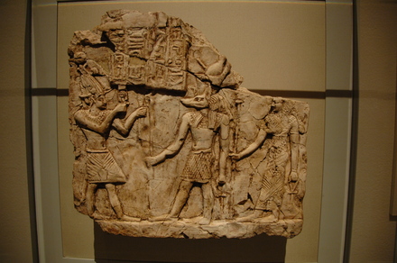 Relief of an emperor sacrificing to Anubis and a goddess