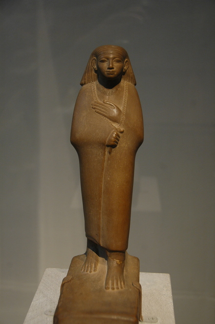 Statuette of a cloaked man