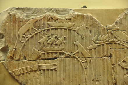 Relief of a cat and birds