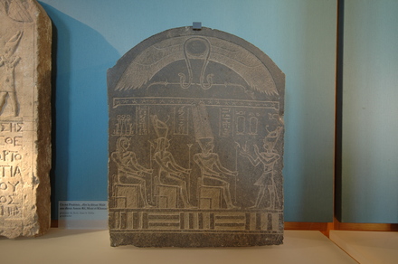 Relief of a Ptolemaic king, sacrificing to three gods