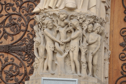 Paris, Portal of the Notre Dame with relief with Adam and Eve