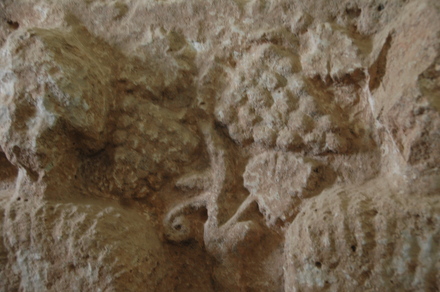 Ghanafes, relief of a couple with a vine