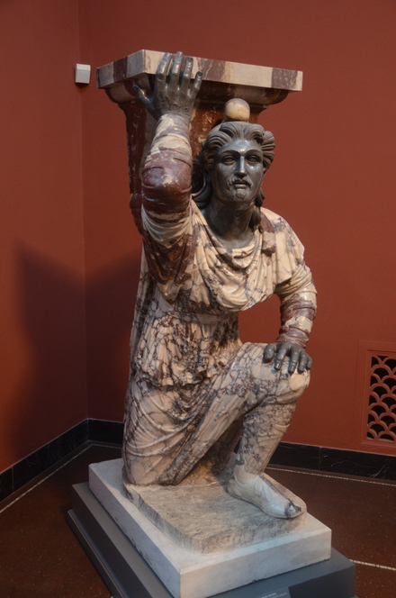 Stand of a kneeling Parthian