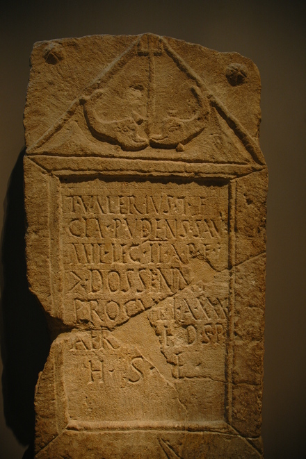 Tombstone of Titus Valerius soldier in legion II Adiutrix, decorated with two dolphins
