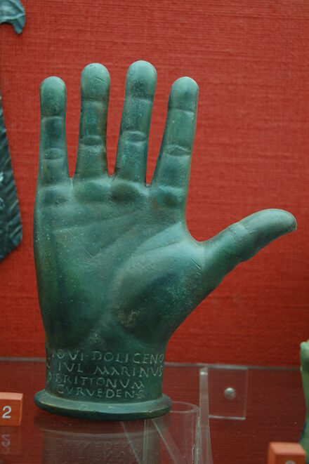 Bronze hand of Jupiter Dolichenus with Roman inscription