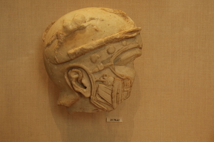 Fragmentary marble head of a helmeted soldier