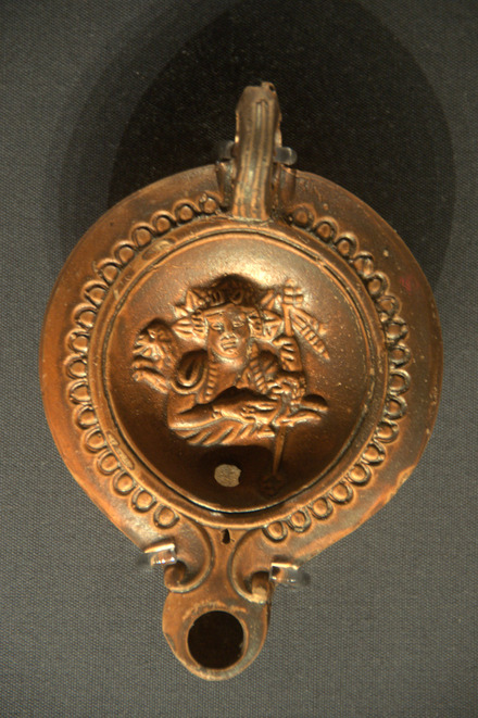 Oil lamp with the god Bacchus