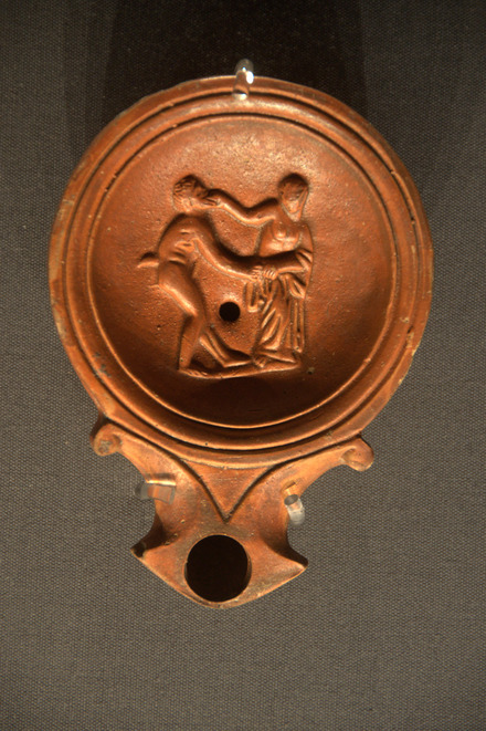 Oil lamp with satyr and maenad