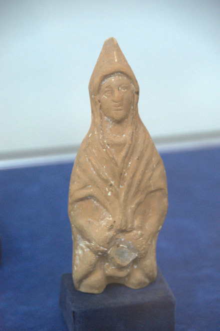 Figurine of a hooded woman or young man