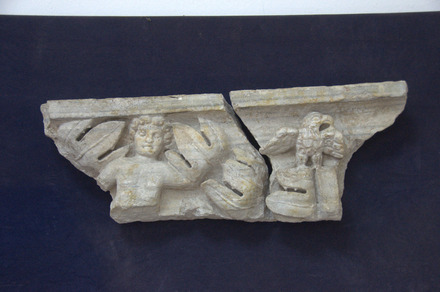 Relief of a military eagle and a genius