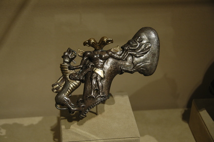 Axe in the shape of a two-headed demon, mastering a boar and a dragon