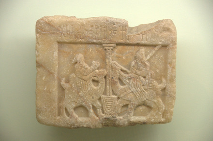 Relief of a man and a woman, riding dromedaries, meeting at a well