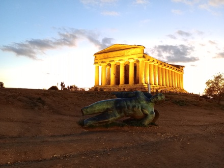 Temple of Concordia, and the modern statue of Icarus, at sunset.