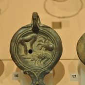 Roman oil lamp depicting a aquatic animals