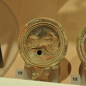 Roman oil lamp depicting a chariot