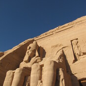 Abu Simbel, Statues of sitting pharaoh's near the entrance, partially damaged
