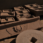 Karanis, Excavations, Frieze and millstone