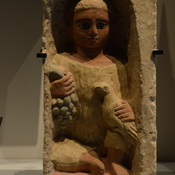 Antinopolis, Stele of boy with grapes in one hand and a dove in the other