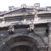Nîmes, Arch above entrance of amphitheater, detail with oxen
