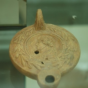 Lepcis Magna, Oil lamp with a woman's head