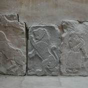 Tell Halaf, West palace south wall, orthostats with a goose, palm tree and a soldier with a spear