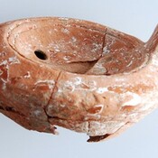 Clay oil lamp. Vaulted tomb. Metropolis.